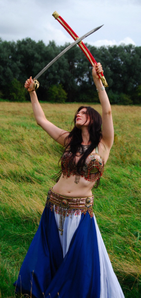 Caitlyn, bellydancer with crossed swords.